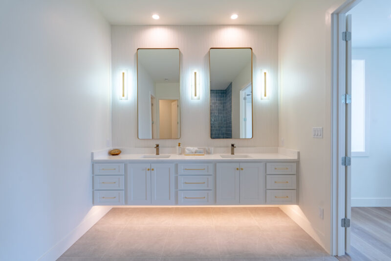 Luxury 2nd primary suite with floating modern vanity and double sinks.