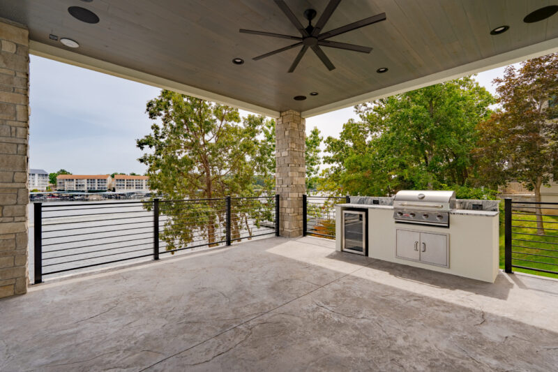 Modern home with a covered patio and outdoor kitchen.