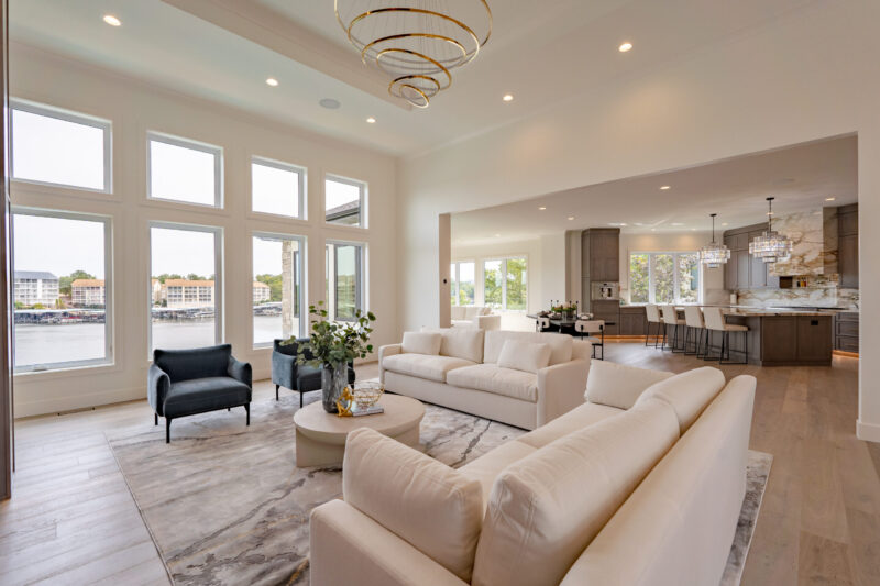 Beautiful modern living room with open floor plan leading into the kitchen.