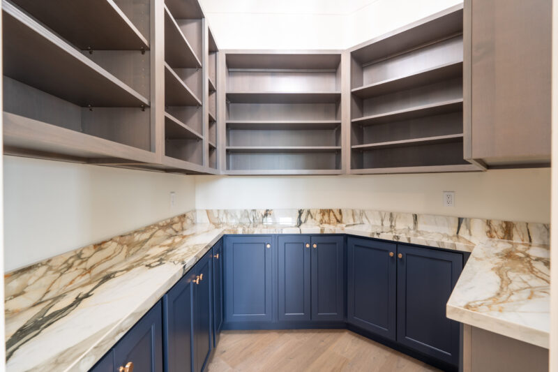 Pantry located directly off kitchen for extra storage to keep counters in the kitchen clean and clutter free.