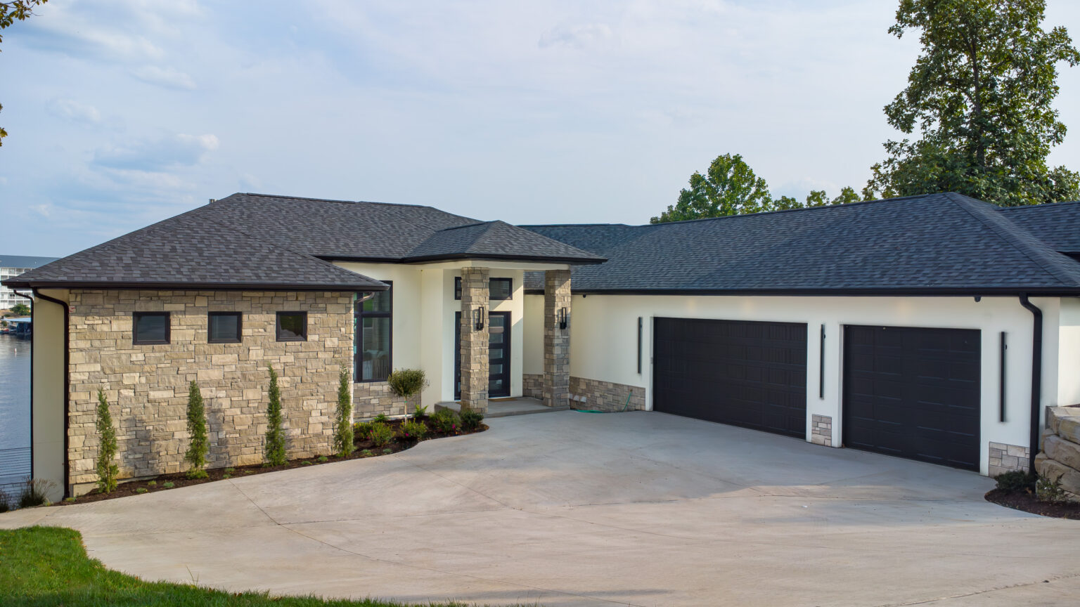 Luxury Modern home with grand stone front entrance