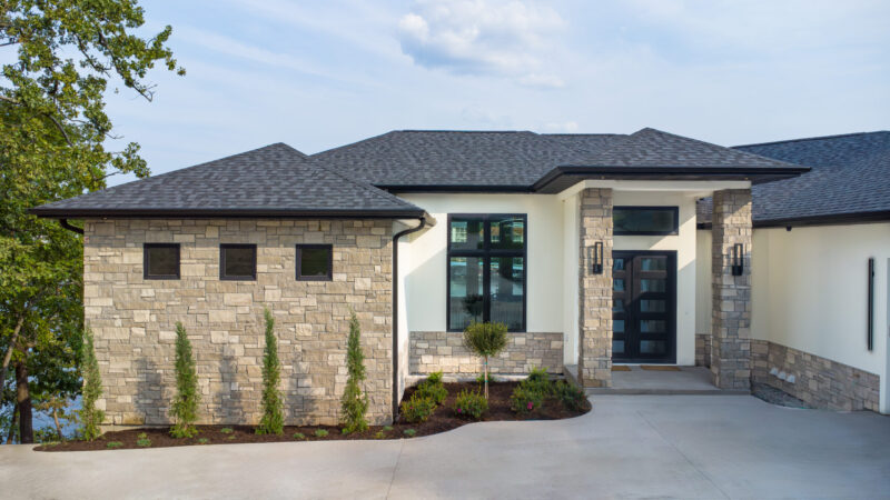 Luxury Modern home with grand stone front entrance