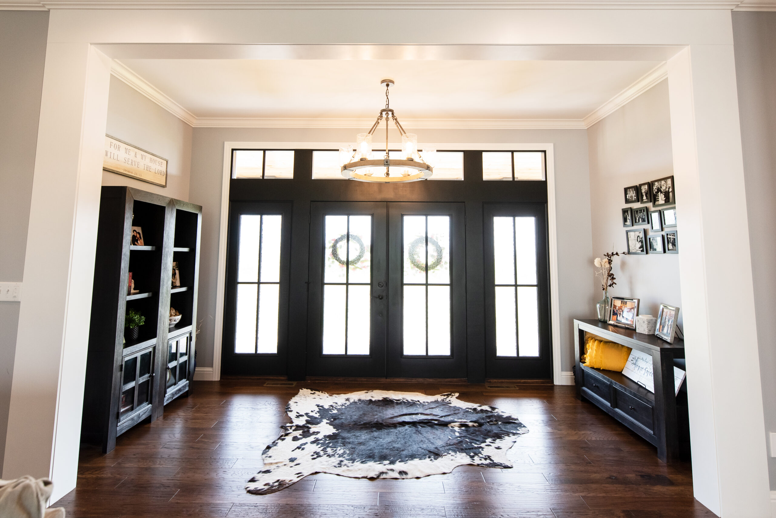 Front entry with beautiful black double doors.