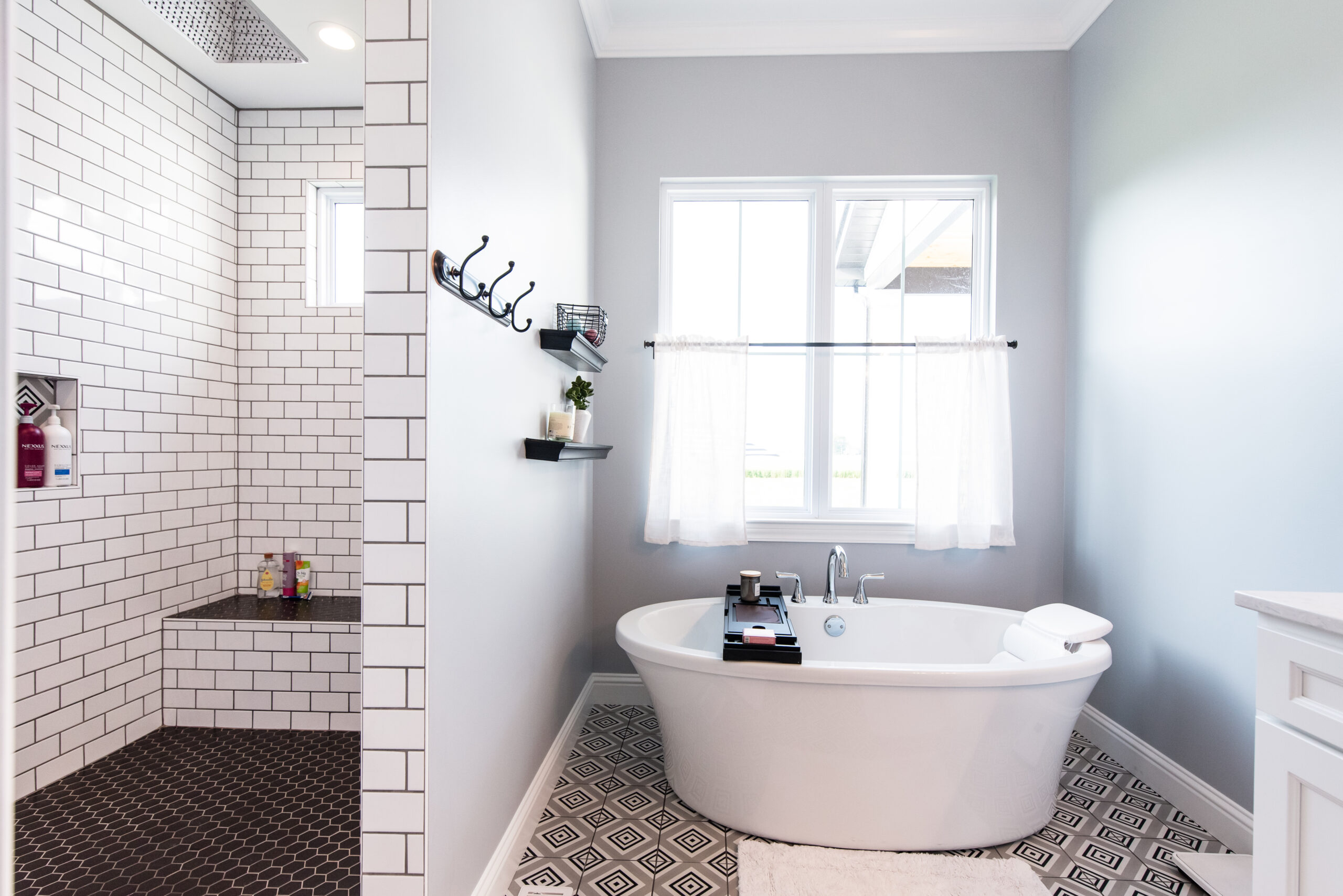 Primary bathroom with a farmhouse-style soaker tub.