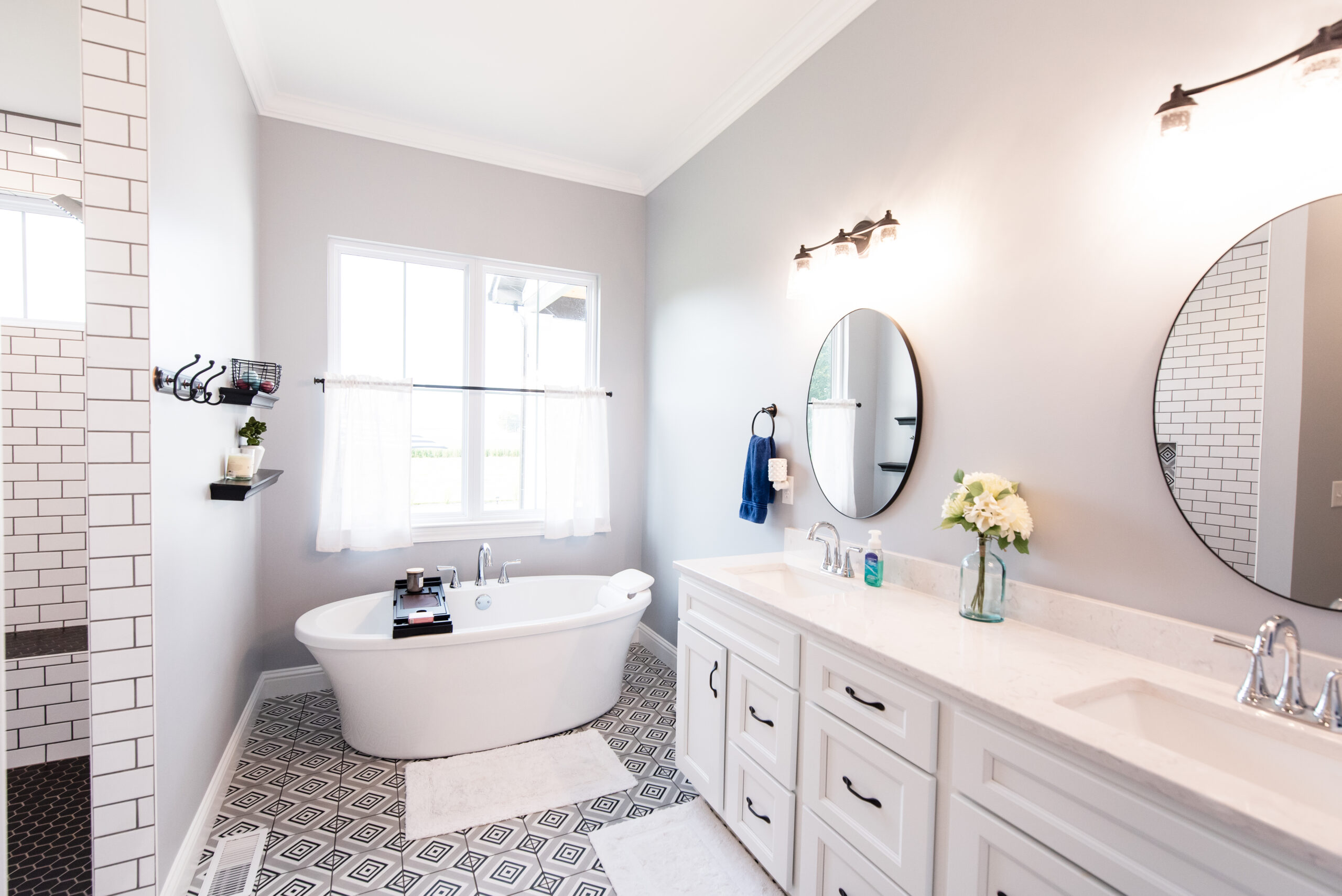 Primary bathroom with a farmhouse-style soaker tub.